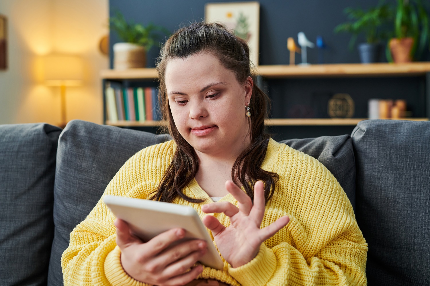 Young Woman With Disability Using Tablet