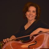 Headshot of middle aged brunette ID Life staff member next to her cello