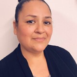 Headshot of middle aged Hispanic woman and ID Life staff member Lori G.